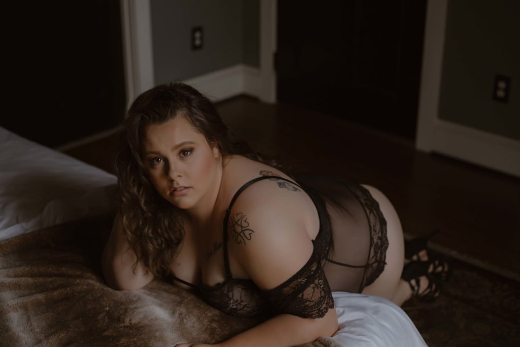 Tattooed boudoir photography with black lingerie